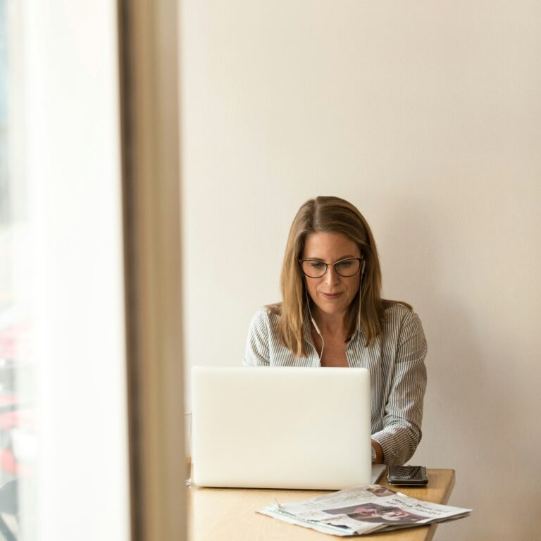 Business owner at a laptop working through a tax problem
