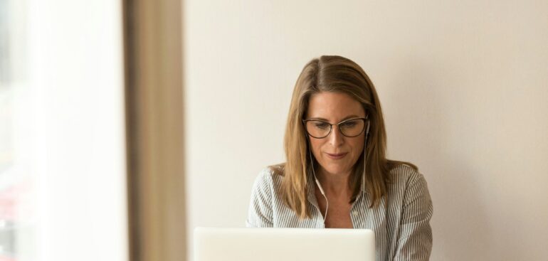 Business owner at a laptop working through a tax problem