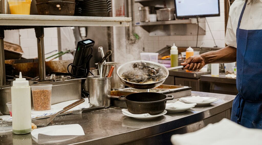 Cook preparing food in a commercial kitchen