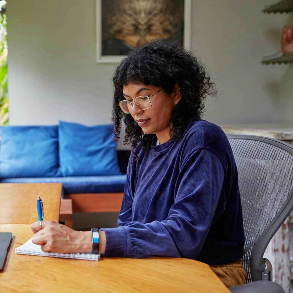 Self-employed woman working at her home office desk