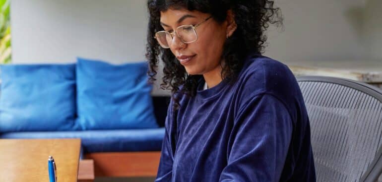 Self-employed woman working at her home office desk