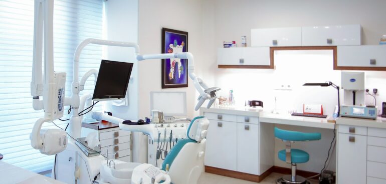 Modern dental office with treatment chair and equipment