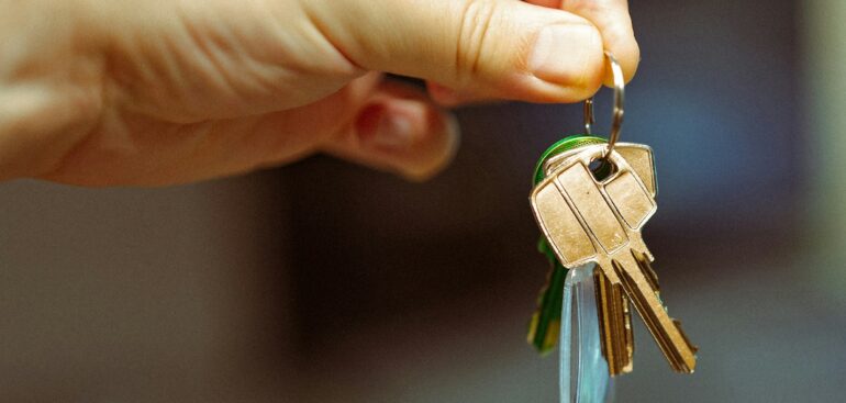 Landlord holding the keys to a rental property