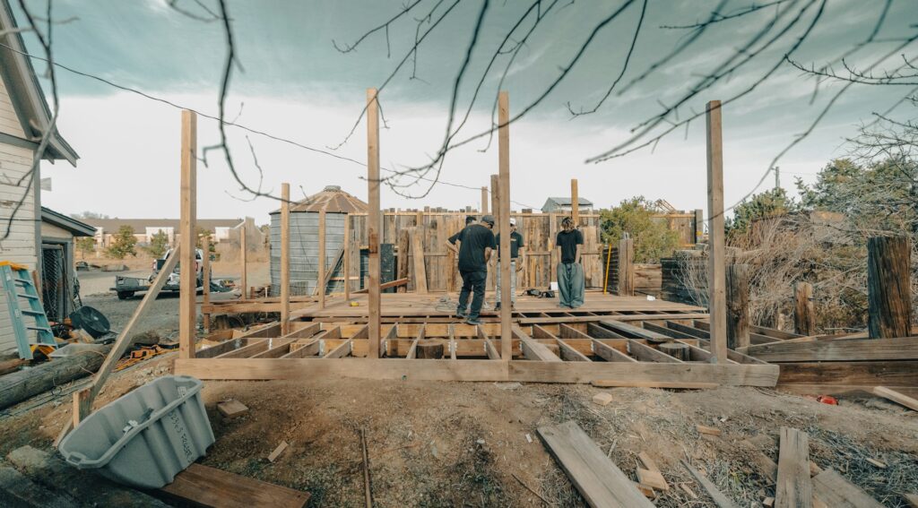 Subcontractors building a wooden structure on a residential job site