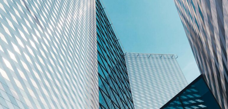 Blue glass office building, abstract background
